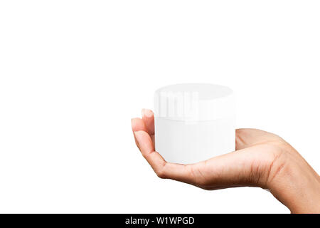 Isolato mano azienda cosmetica bianco vaso su uno sfondo bianco con percorso di clipping. Foto Stock
