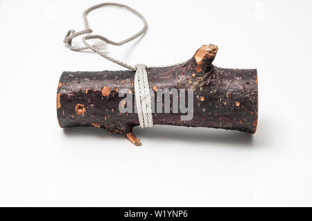 Un pezzo di anatra o chiamata di gioco che appare costituito da un ramo di albero. Foto Stock