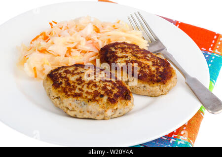 Decapare il cavolo con cotolette oa piastra bianca Foto Stock