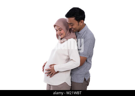 Azienda il marito e la moglie incinta pancia sul background isolato Foto Stock