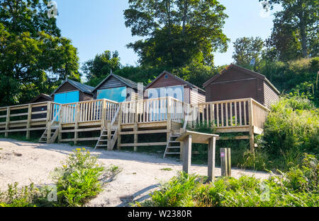 Ombrelloni sulla spiaggia Studland, Studland Bay, sull'Isola di Purbeck, Dorset, Regno Unito Foto Stock