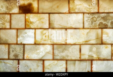 Onyx muro di mattoni in background. Consistenza del colore miele onyx materiale. Foto Stock