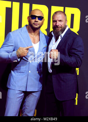 Los Angeles, California, Stati Uniti d'America 10 luglio 2019 lottatore/attore Dave Bautista e wrestler attore/Triple H, aka Paul Michael Levesque assiste XX Century Fox "tuber' Premiere sulla luglio 10, 2019 a Regal Cinemas L.A. Vive a Los Angeles, California, USA. Foto di Barry re/Alamy Live News Foto Stock