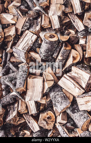 Un trito di Fire ciocchi di legna pila pila sfondo astratto Foto Stock