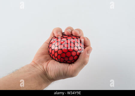 Maschio di spremitura a mano palla Foto Stock