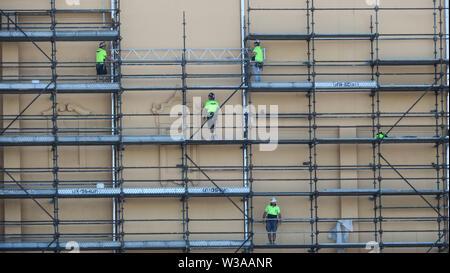 Melbourne Australia: i lavoratori sui ponteggi su un cantiere di Melbourne. Foto Stock