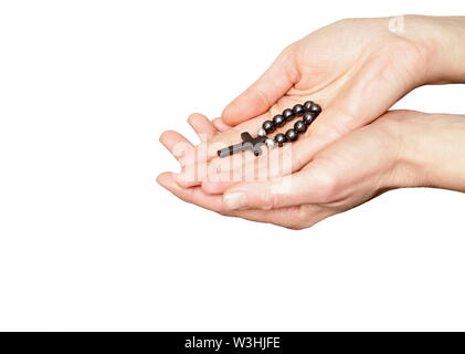 Donna che prega insieme a mano protesa con il crocifisso e il rosario croce immagine stock e stock photo Foto Stock