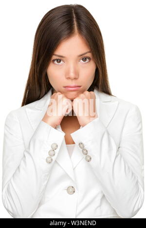 Ritratto di infelice giovane imprenditrice con le mani sul mento isolate su sfondo bianco Foto Stock