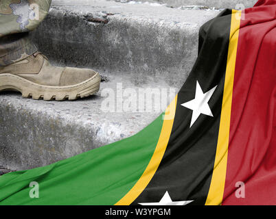 Concetto militare sullo sfondo della bandiera di Saint Kitts e Nevis Foto Stock
