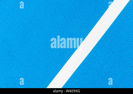 Blu acceso via gomma sintetica sull'athletic stadium. Foto Stock