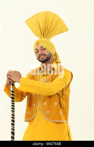 Man performing bhangra dance Stock Photo