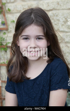 Un ritratto di un 7 anno vecchia ragazza Foto Stock