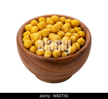 Le sfere di corn flakes nel recipiente di legno isolato su sfondo bianco Foto Stock