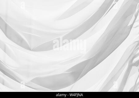 Decorativo in tulle bianco con pieghe, close-up foto di sfondo texture Foto Stock