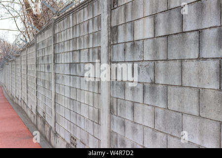 Primo piano di cemento grigio blocco di muro Foto Stock