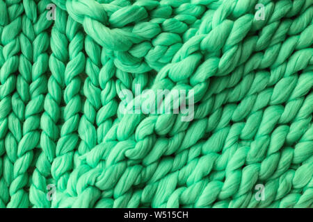 Close-up del tessuto lavorato a maglia a una coperta di lana merinos sfondo Foto Stock