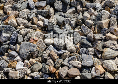 Di ghiaia con sfondo grigio, marrone e arancione marrone Colori, compreso il granito. Foto Stock