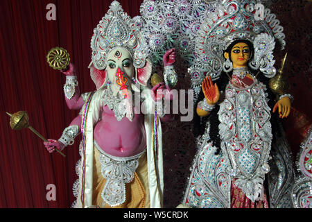 Statue of Lakshmi and Ganesha in a temple, India Stock Photo