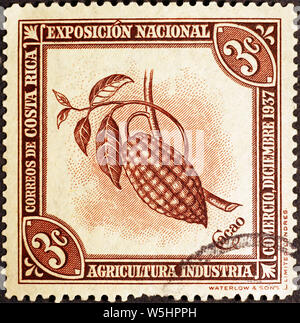 Pod di cacao su vintage francobollo del Costa Rica Foto Stock