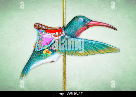 Giostra di carnevale hummingbird isolato su sfondo verde Foto Stock