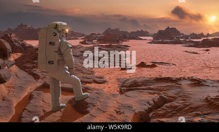 Astronauta sul pianeta Marte guardando il Rising Sun Foto Stock