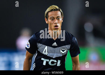 Keisuke Honda dell'Australia Melbourne vittoria reagisce durante il loro gruppo F match di AFC Champions League 2019 nei confronti della Cina di Guangzhou Evergrande Foto Stock