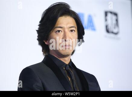 **TAIWAN OUT * * giapponese attore e cantante Takuya Kimura partecipa ad un evento promozionale per il video gioco "Giudice occhi' a Taipei, Taiwan, 2 dicembre 2018. Foto Stock