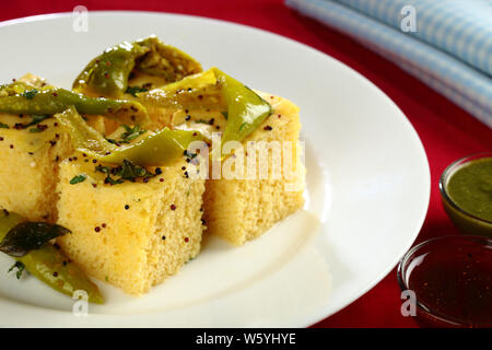 Kachoris served in a plate with chutneys Stock Photo