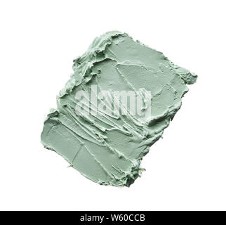 Delicatamente pennellate di colore verde e la consistenza di crema per il viso o vernice acrilica isolati su sfondo bianco Foto Stock