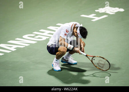 Kei Nishikori del Giappone reagisce come egli compete contro Sam QUERREY degli Stati Uniti nel loro terzo round match di uomini singoli durante il Rolex Foto Stock