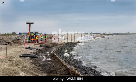 Restauro di spiaggia di sabbia sulla costa Norderney, Germania Foto Stock