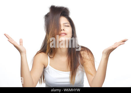 Young woman frustrated with her tangled hair Stock Photo