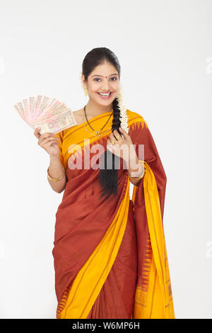 South Indian woman showing banknotes Stock Photo