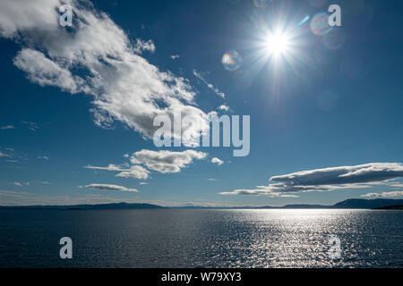 Sole mare nuvole Foto Stock