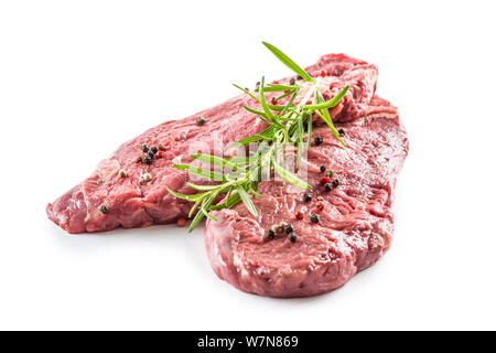 Carni bovine meeat Rib-Eye steak wit Rosmarino sale e pepe isolato su bianco Foto Stock