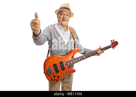 Uomo maturo con un Bass Guitar Mostra pollice in alto isolato su sfondo bianco Foto Stock