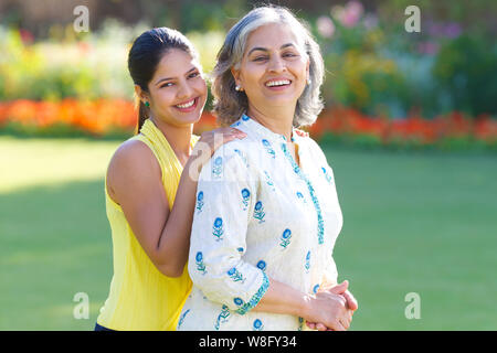 Mother with her adult daughter in a park Stock Photo