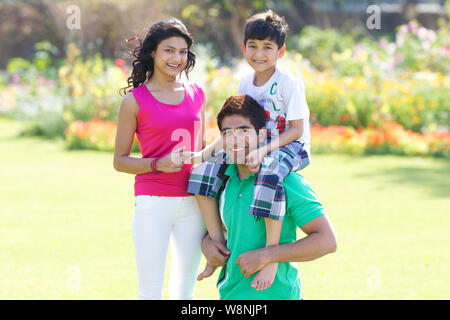 Family playing in a garden Stock Photo