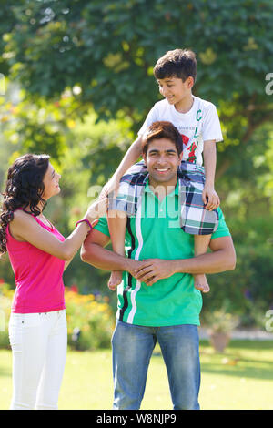 Family playing in a garden Stock Photo