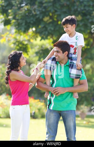 Family playing in a garden Stock Photo