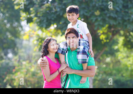 Family playing in a garden Stock Photo