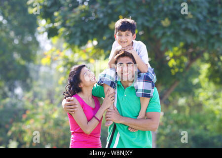 Family playing in a garden Stock Photo