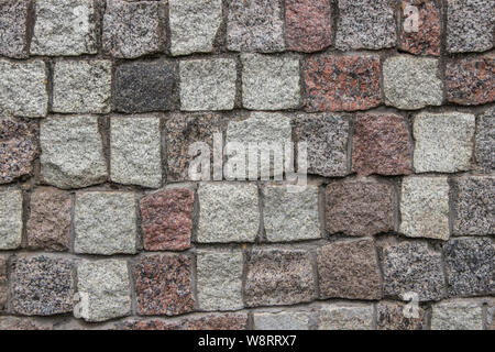 Naturale grigio pietra da costruzione per pareti di pavimentazione e di strade. Texture, sfondo, pavimentazione in pietra Foto Stock