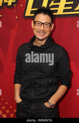 Hong Kong cantante Jacky Cheung pone come egli arriva per le riprese di Alex ot video musicale di Hong Kong, Cina, 29 giugno 2014. Foto Stock