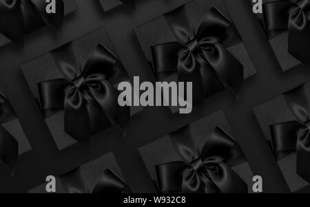 Doni nero su sfondo nero, scuro confezione regalo laici piatta Foto Stock