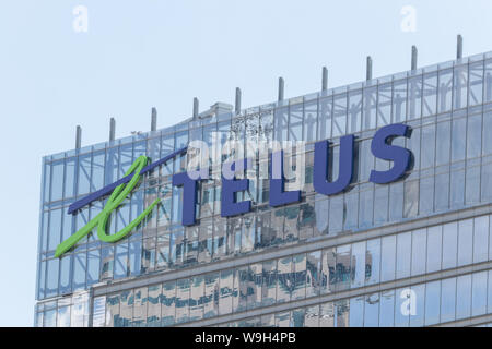 Telus Communications logo in cima delle loro edificio nel centro di Toronto. Foto Stock