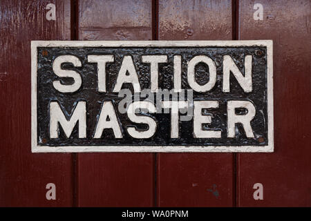 Antica Stazione master segno sulla piattaforma della stazione Foto Stock