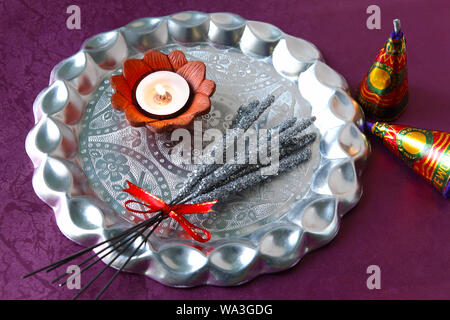 Close up of oil lamp with fire crackers Stock Photo