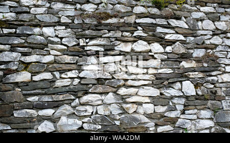 Grigio a muro di pietra che può essere utilizzata come sfondo o del modello Foto Stock