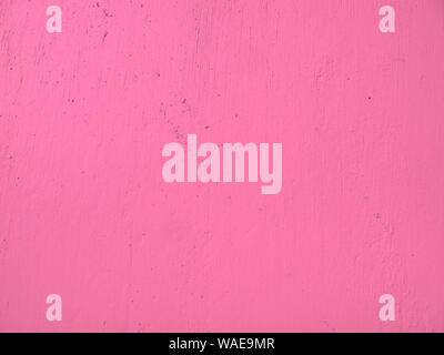La consistenza del materiale delle pareti di cemento, dipinta in rosa Foto Stock